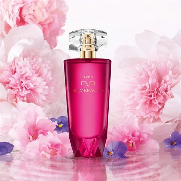 avon eve embrace bottle on a floral background